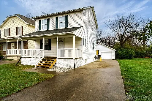 Classic 2-Bedroom House with Detached Garage and Large Lot